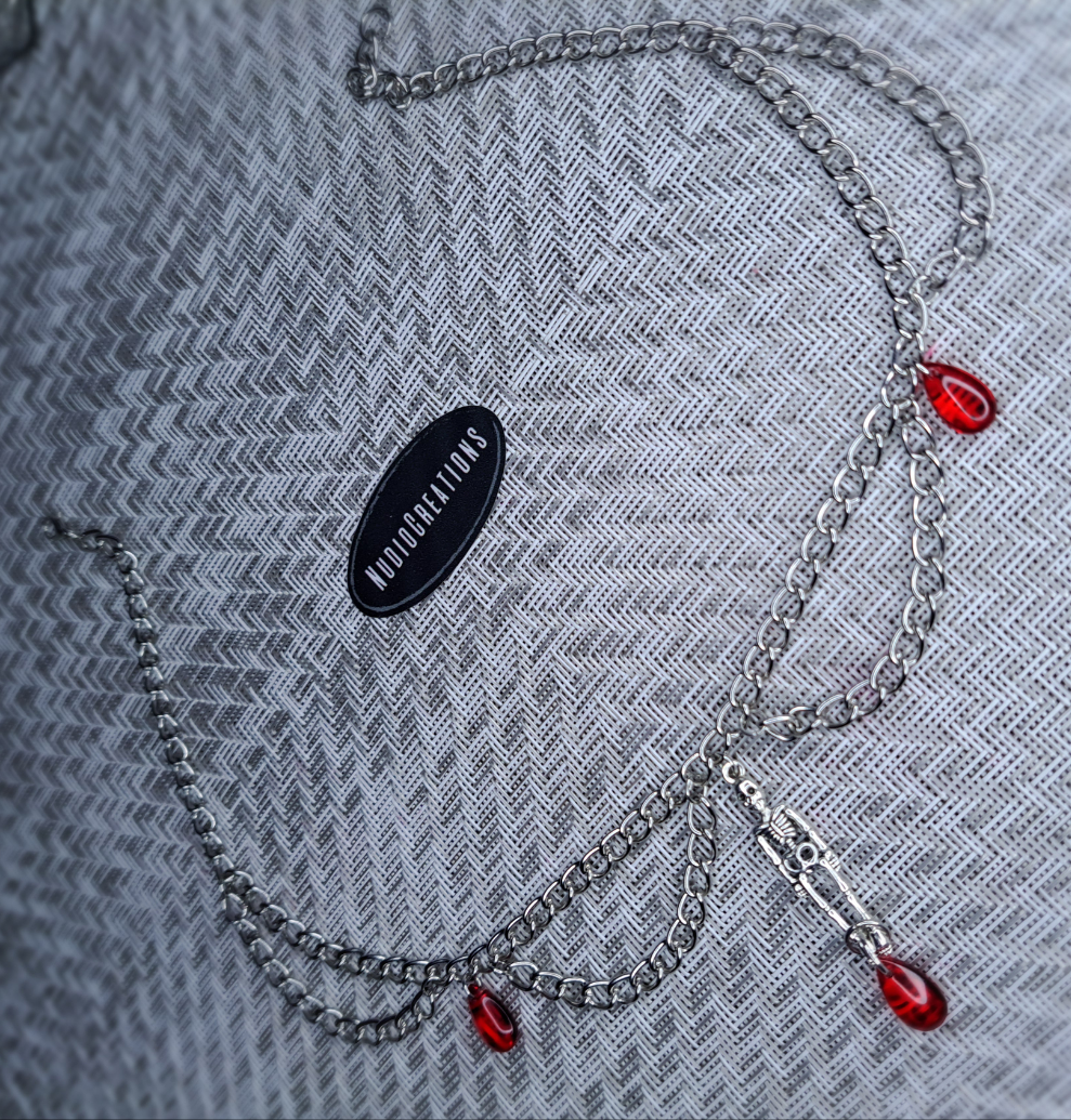 Silver and red skeleton chain necklace