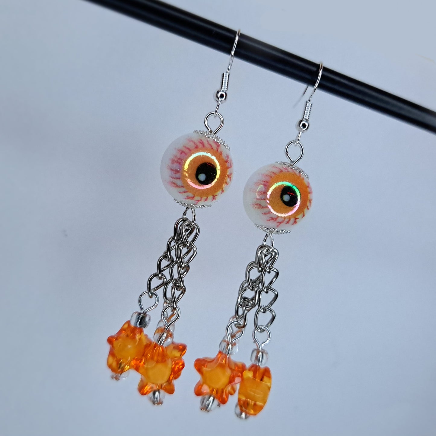 Orange eyeball stainless steel earring