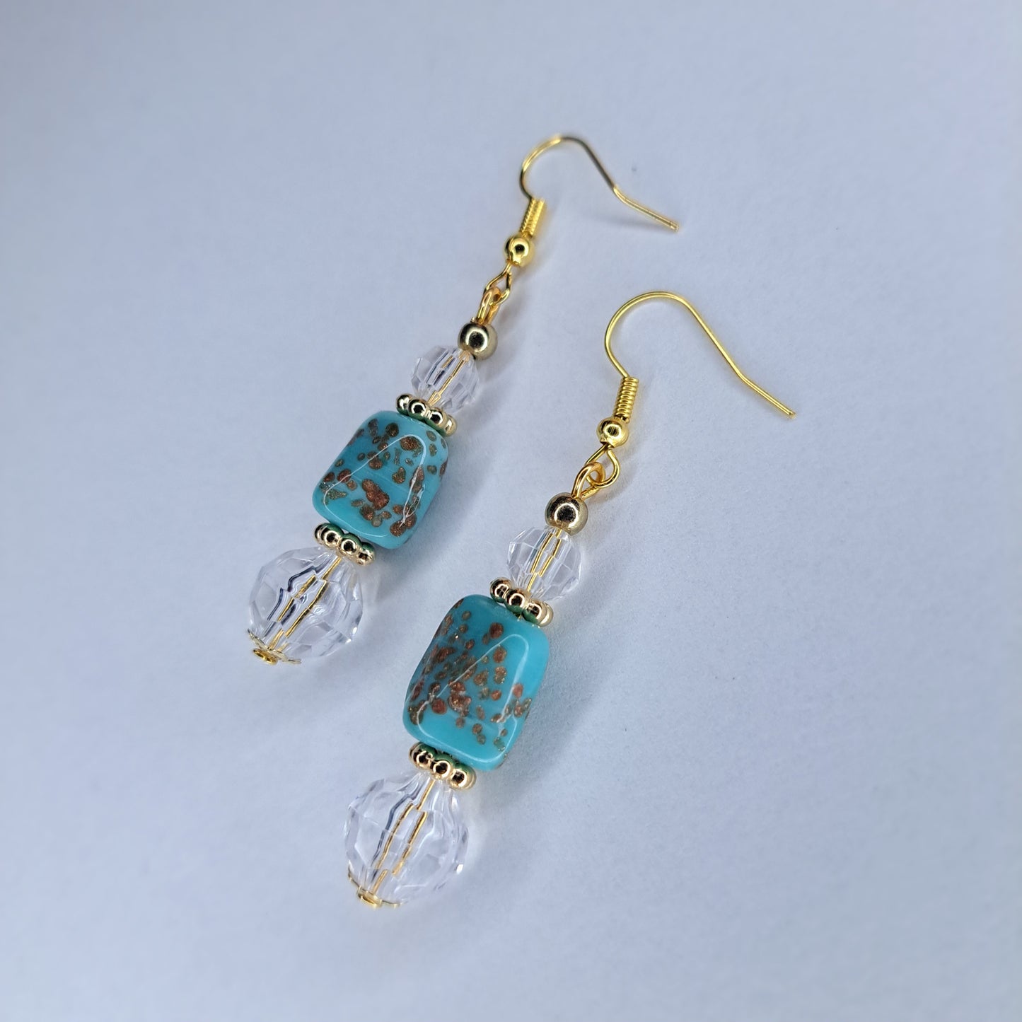 Clear, turquoise, and gold beaded gold tone Stainless steel earrings