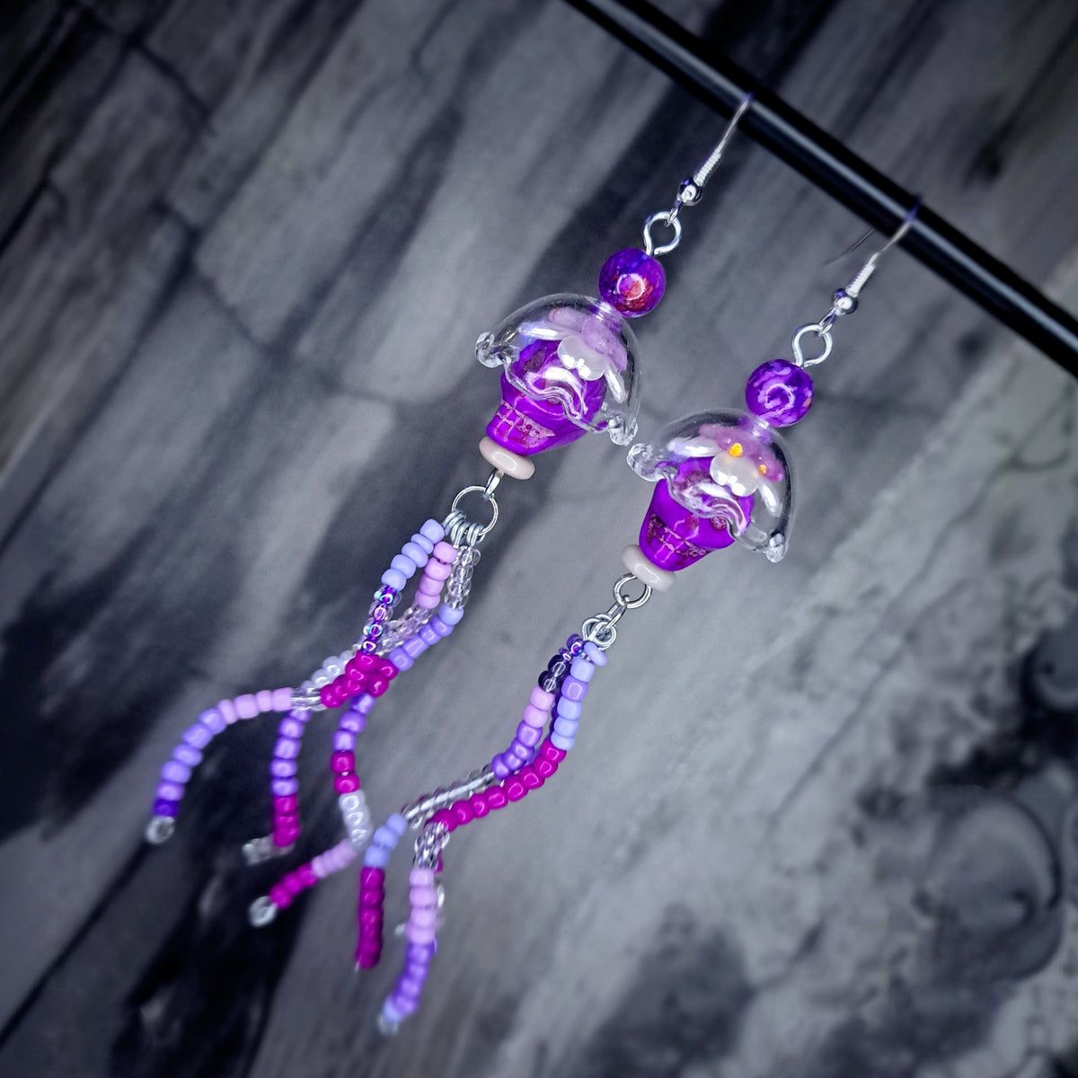 Purple howlite skull jellyfish stainless steel earrings