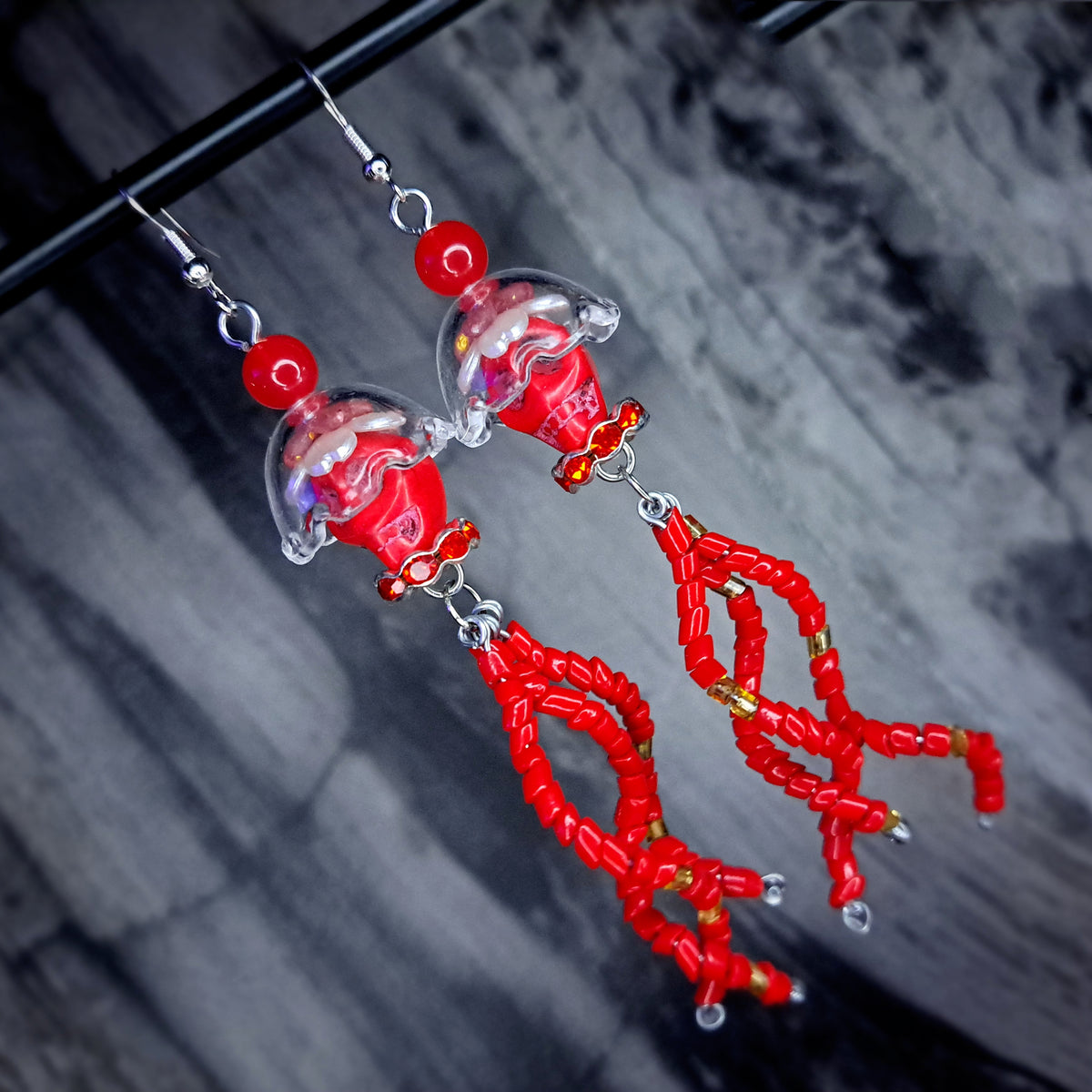 Red howlite skull jellyfish stainless steel earrings
