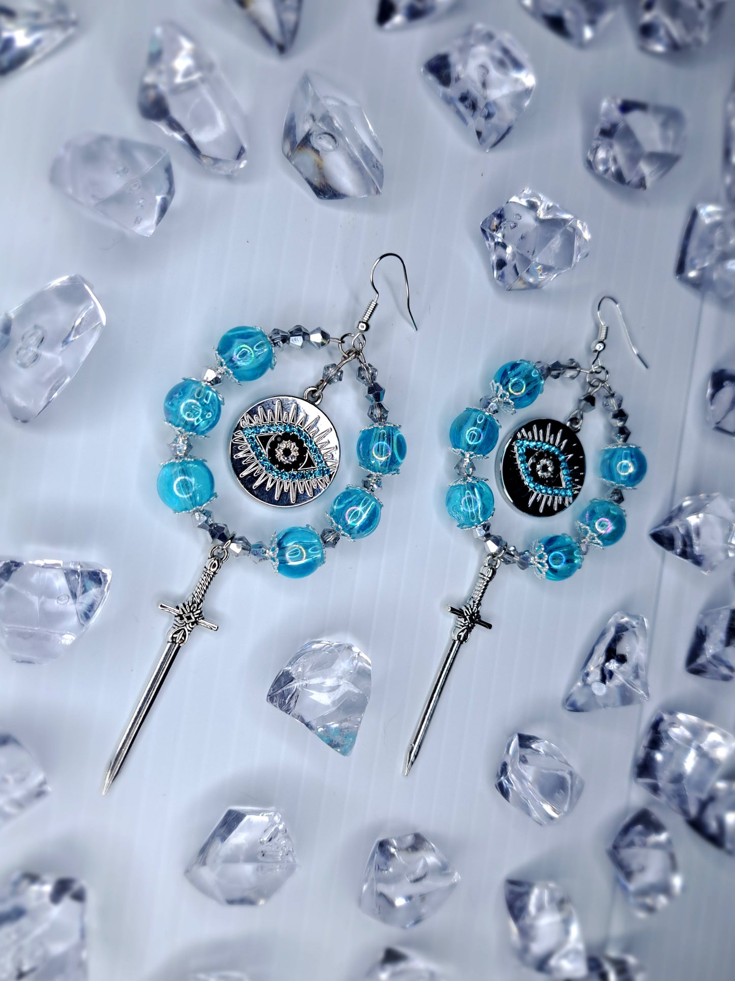Silver and blue beaded eye stainless steel sword hoops earrings