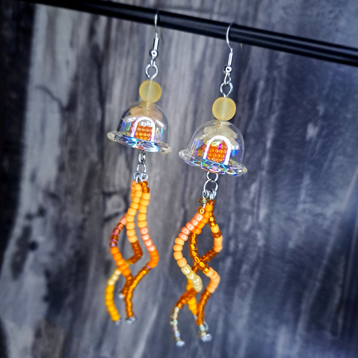 Orange jellyfish stainless steel earrings