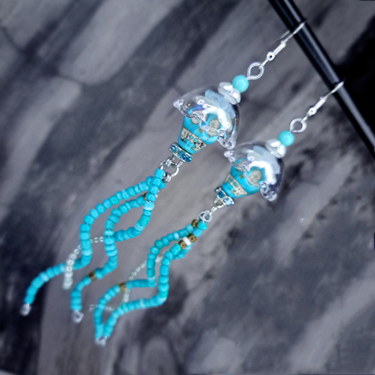 Turquoise howlite skull jellyfish stainless steel earrings