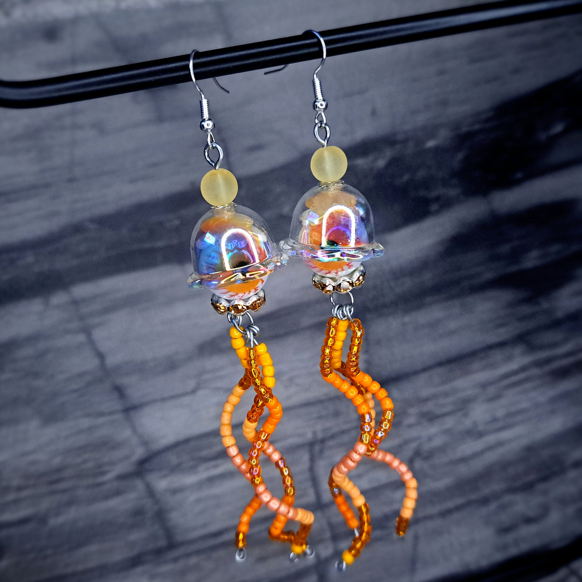 Orange Eyeball jellyfish stainless steel earrings