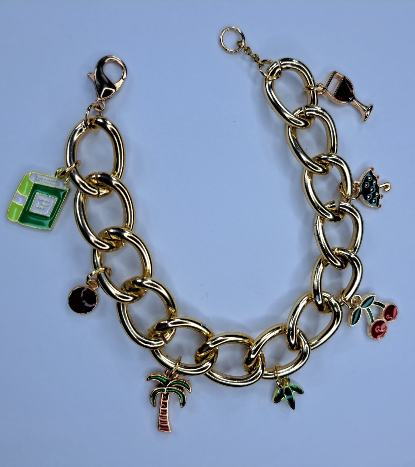 Red, green and gold chain charm bracelet