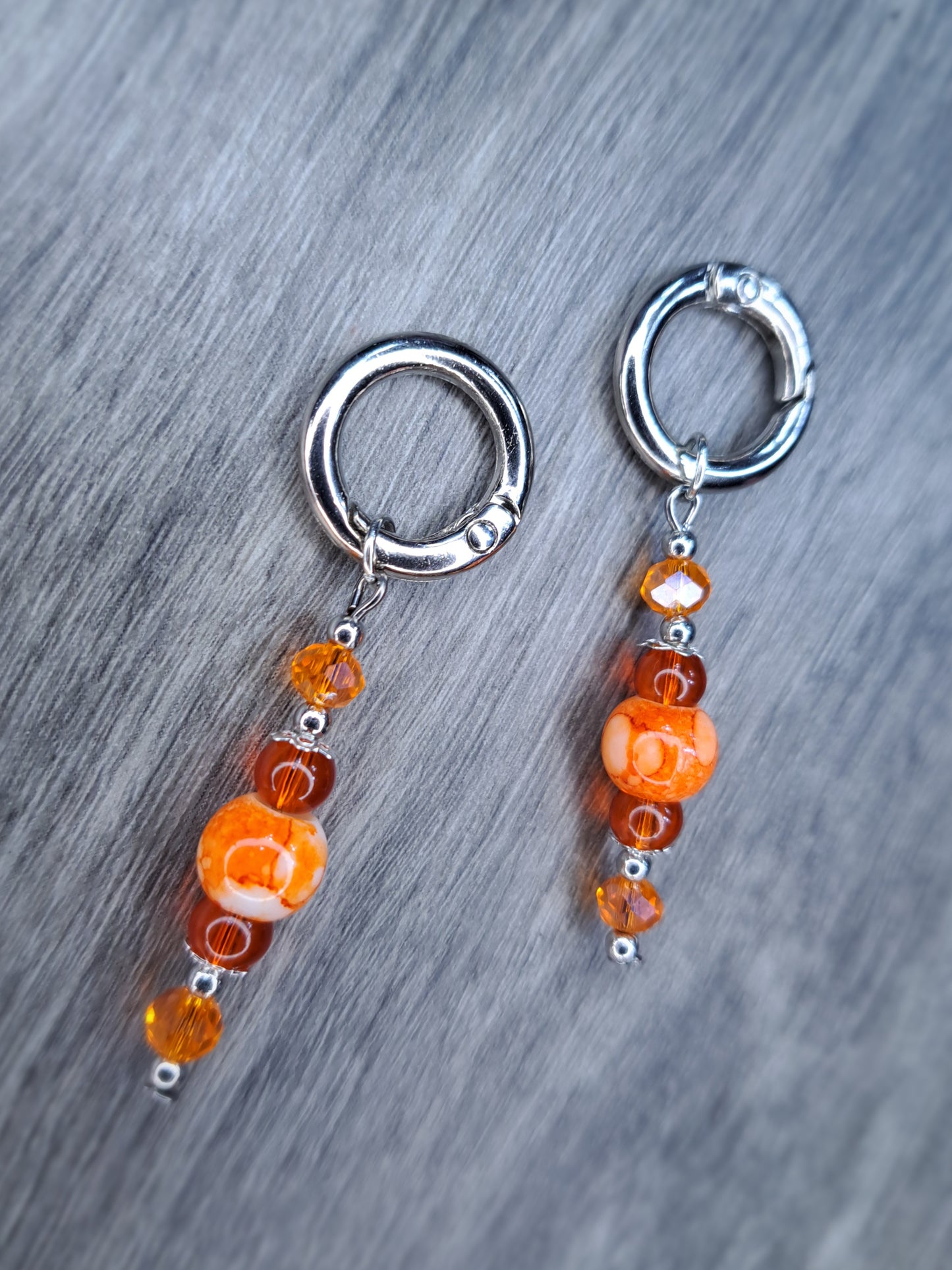 (Stretched ears) Orange beaded stainless steel earrings