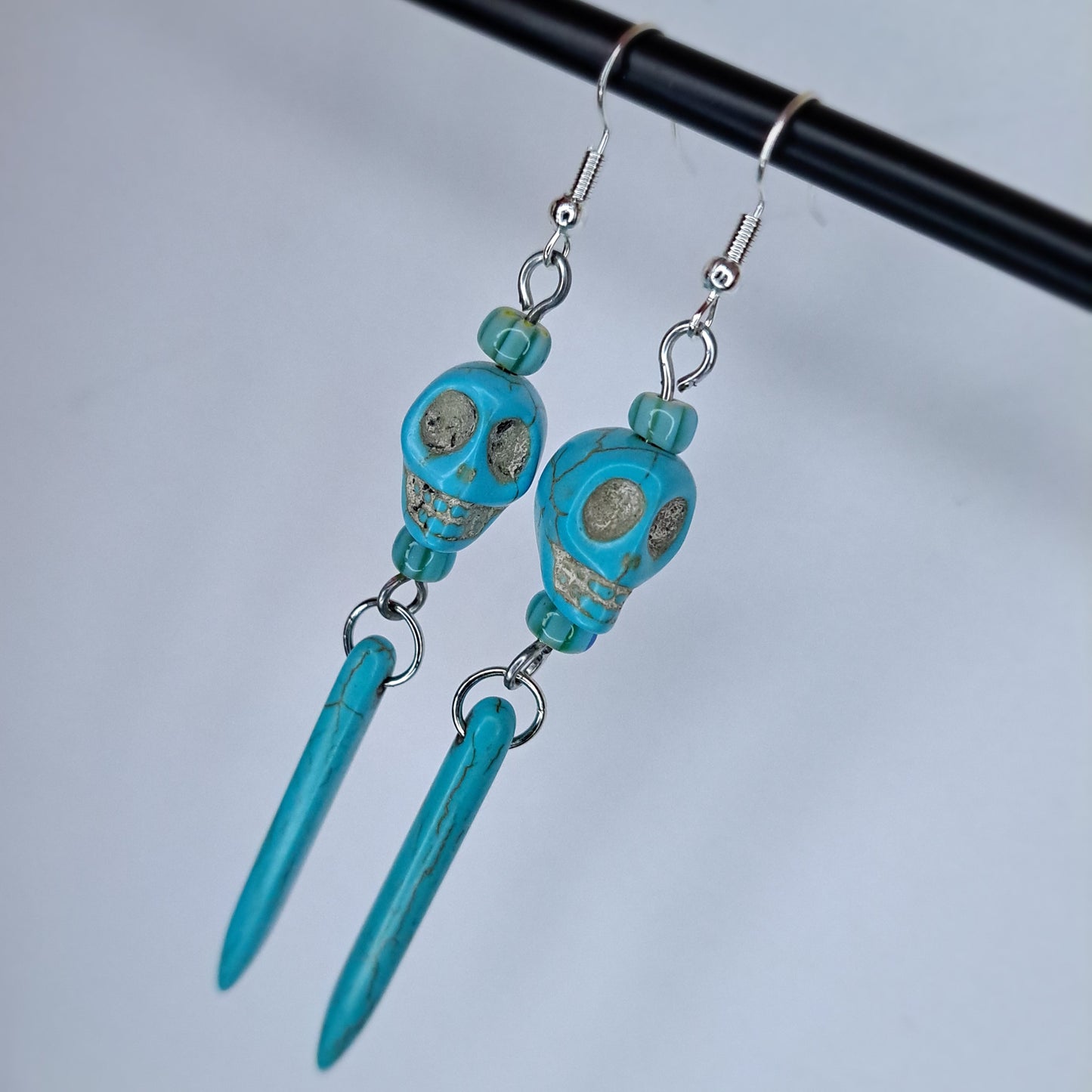 Faux turquoise skull stainless steel earring
