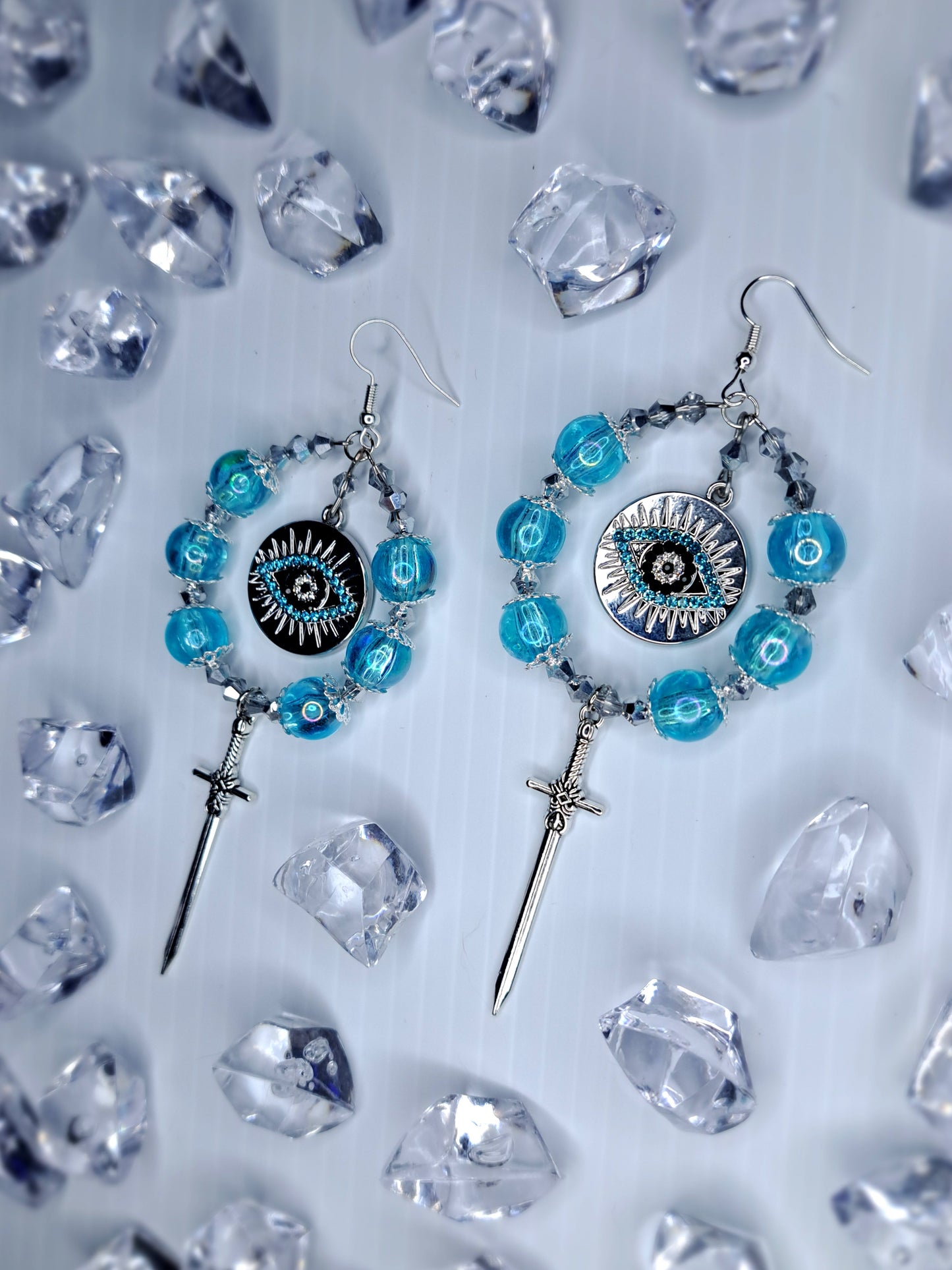 Silver and blue beaded eye stainless steel sword hoops earrings