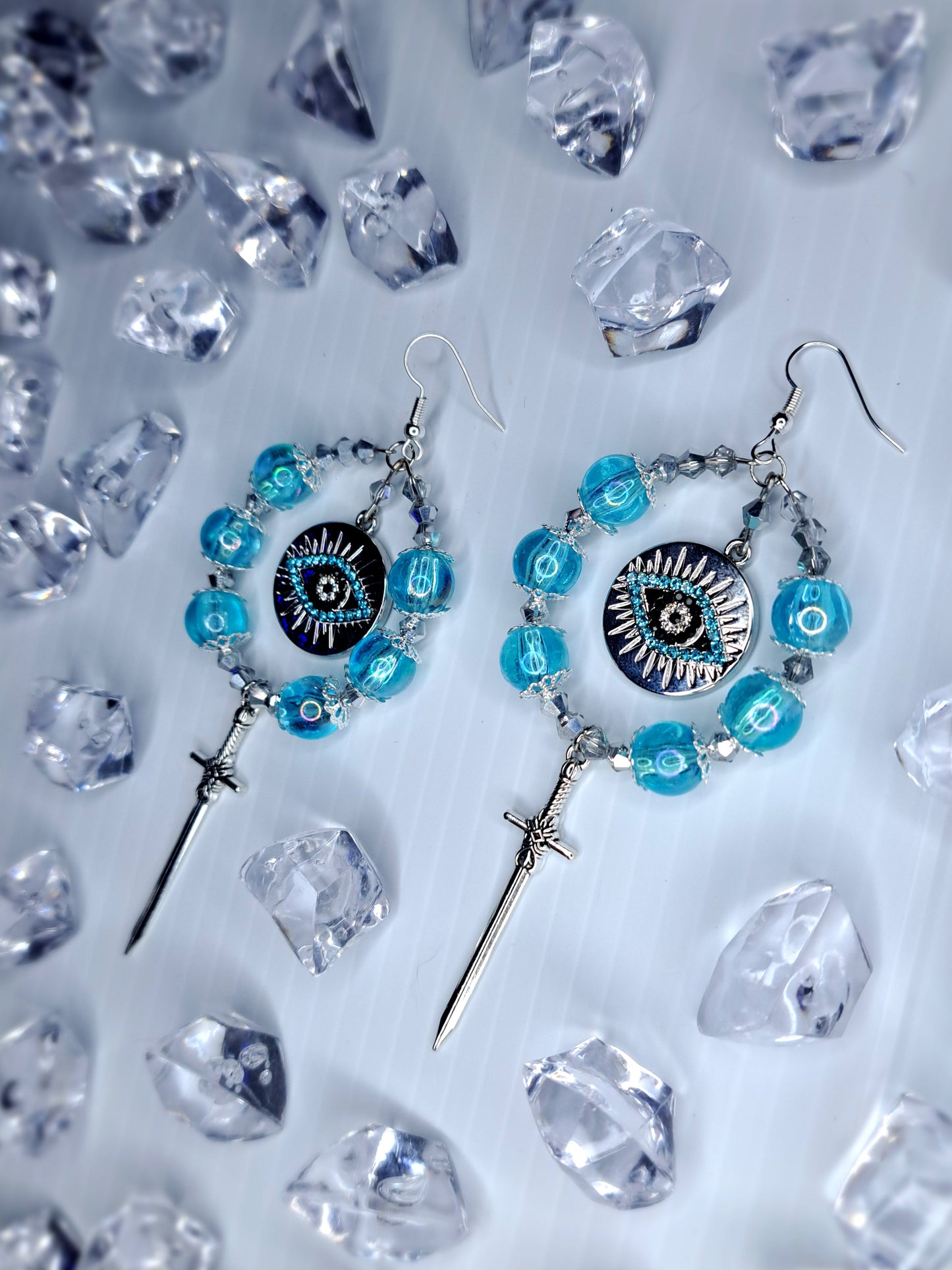 Silver and blue beaded eye stainless steel sword hoops earrings