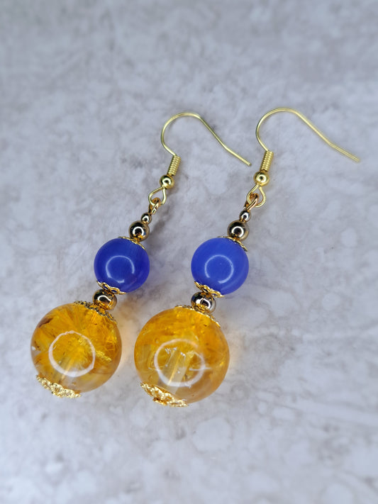 Yellow & blue beaded gold tone dangly stainless steel earrings