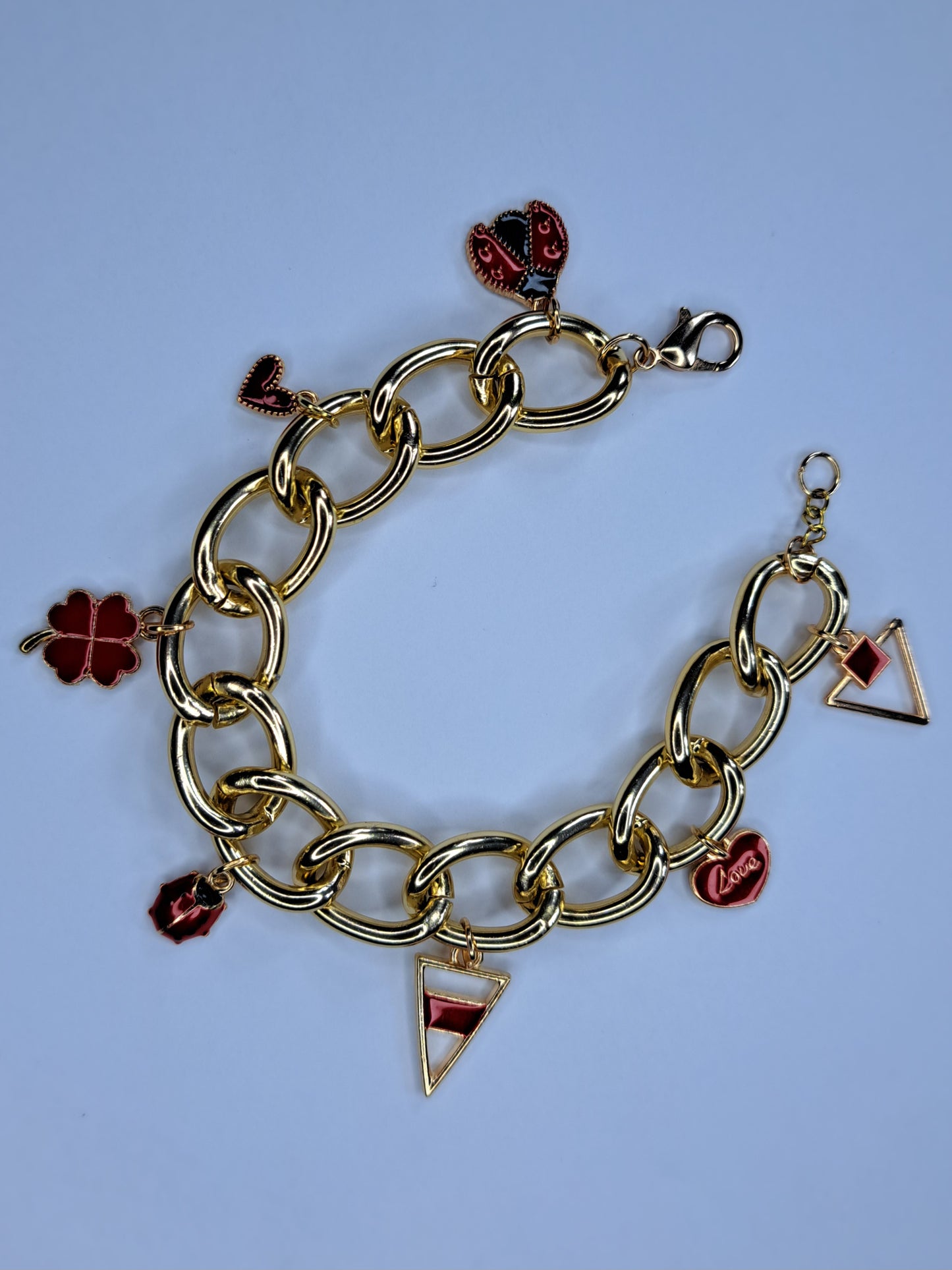 Red and gold chain charm bracelet