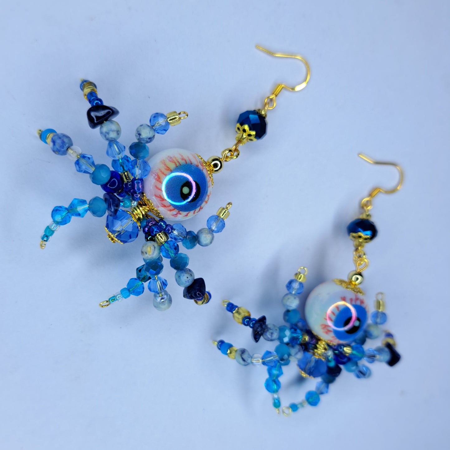 Blue beaded eyeball spider gold tone s925 sterling silver earrings