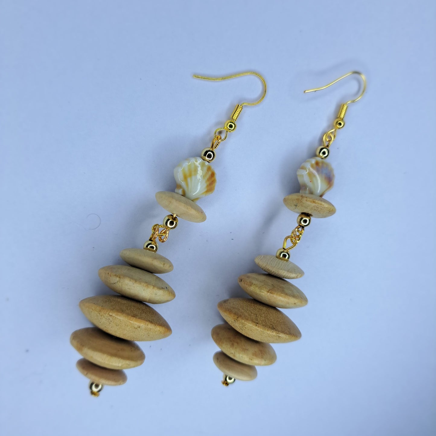 Tan beaded shell gold tone stainless steel earrings