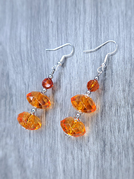 Orange beaded stainless steel dangle earrings