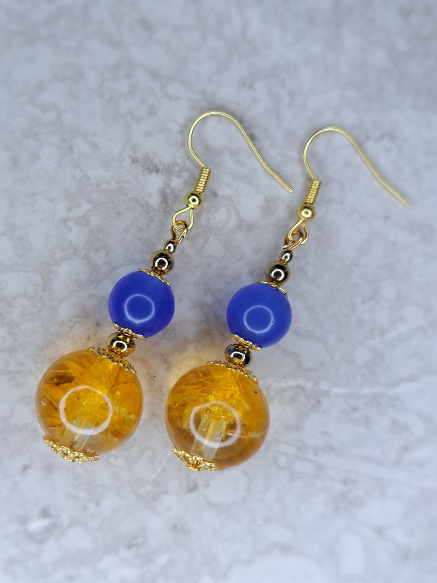 Yellow & blue beaded gold tone dangly stainless steel earrings