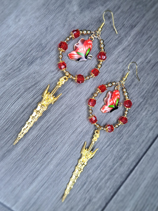 Red beaded silver sword butterfly hoop earrings