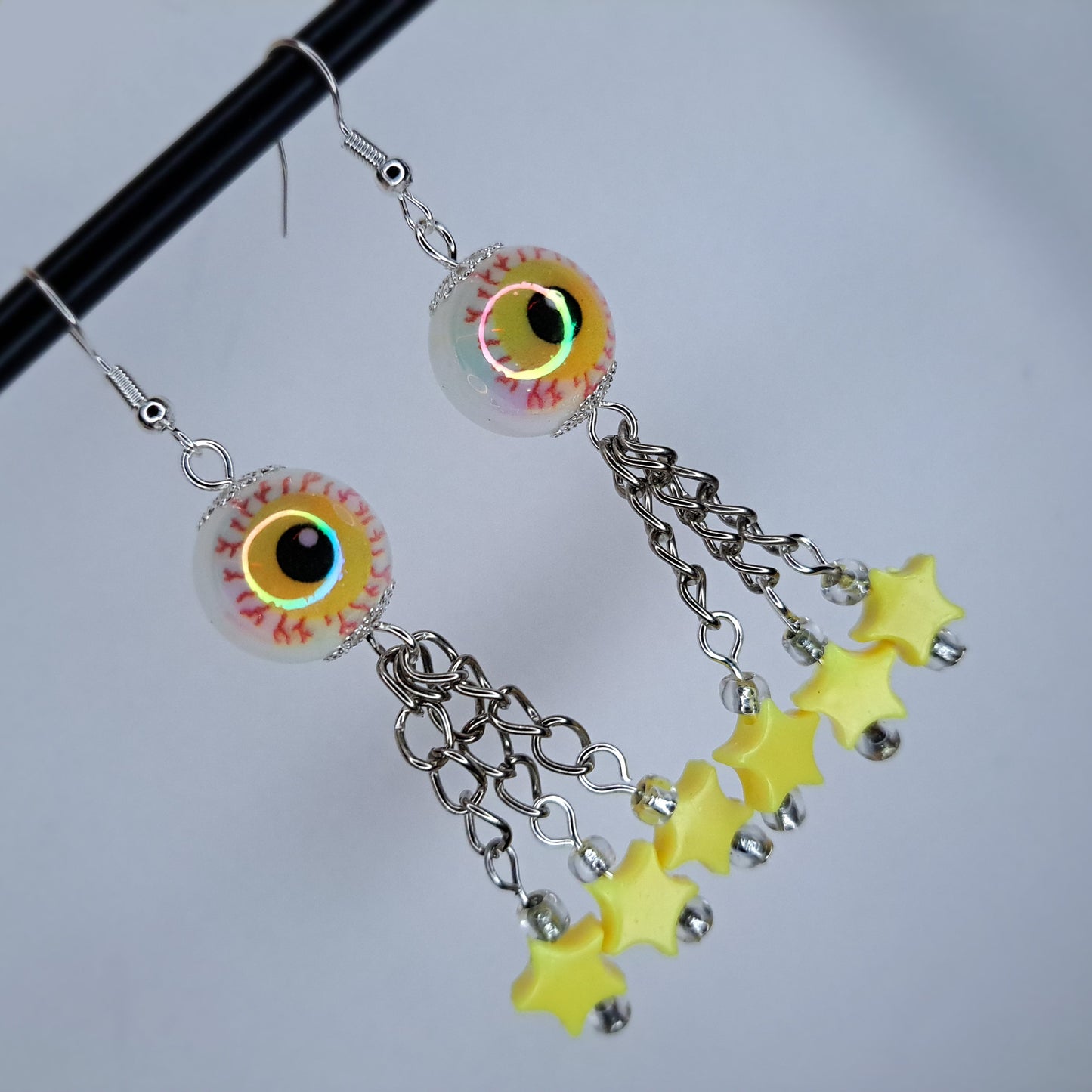 Yellow eyeball stainless steel earring