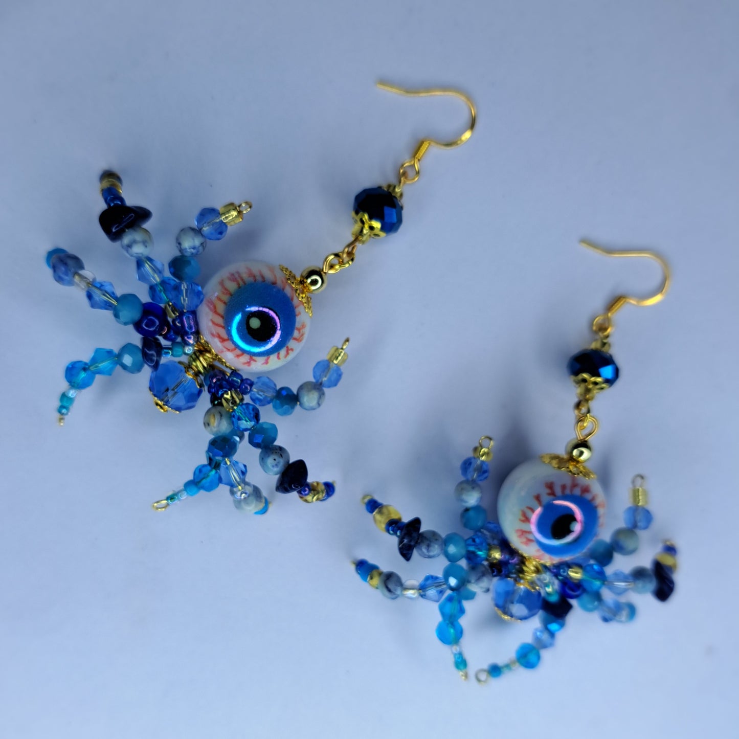 Blue beaded eyeball spider gold tone s925 sterling silver earrings