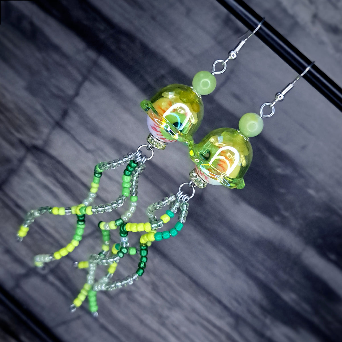 Green Eyeball jellyfish stainless steel earrings