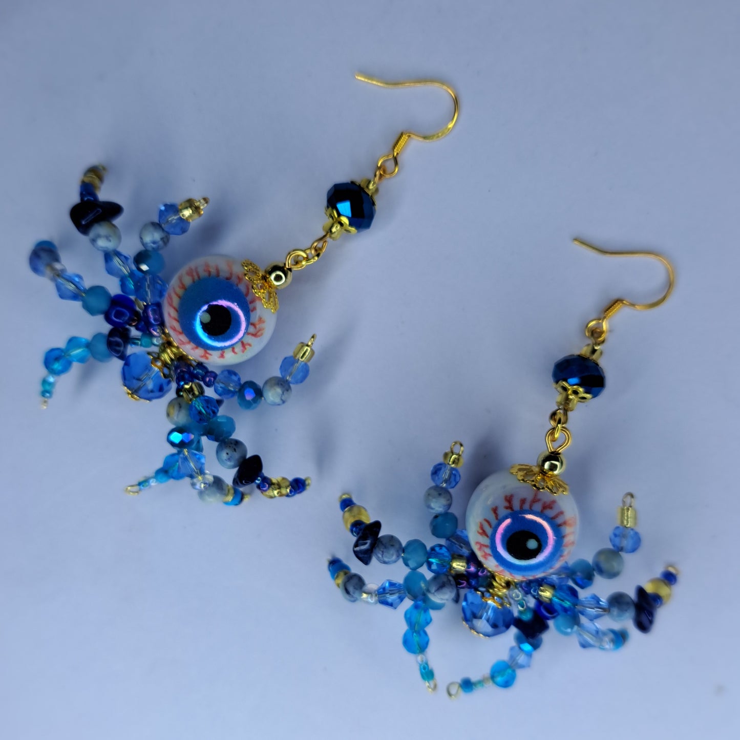Blue beaded eyeball spider gold tone s925 sterling silver earrings