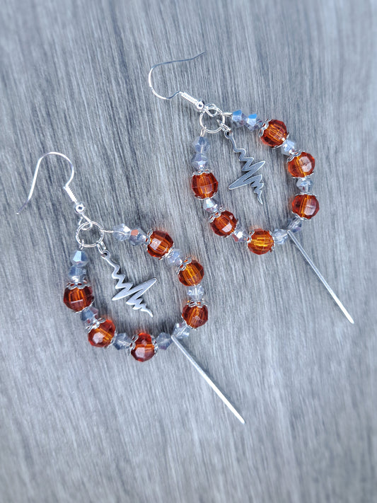 Orange and silver dangly hoop sword earrings