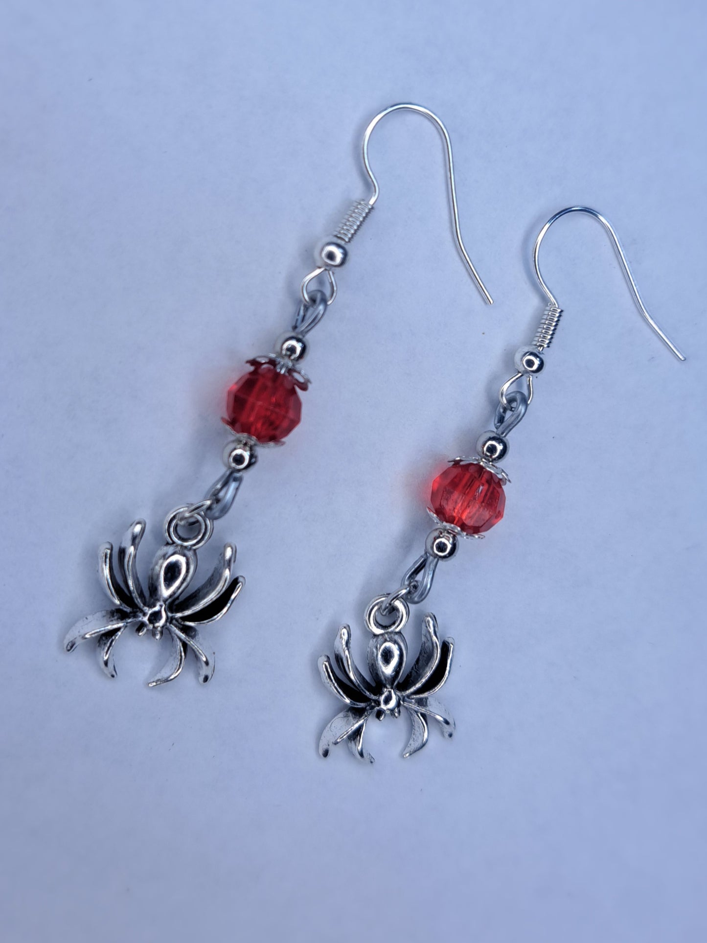 Red beaded stainless steel spider earrings