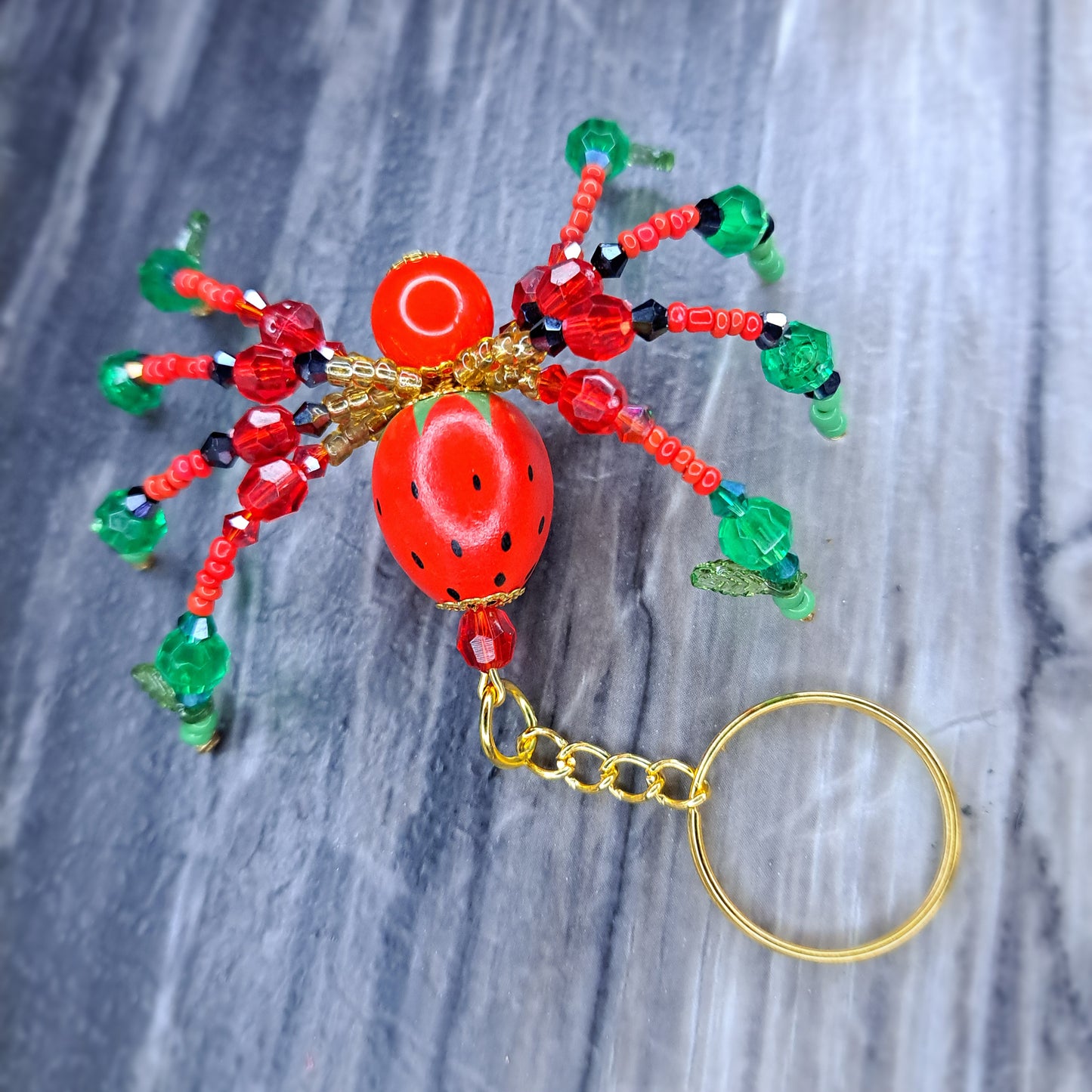 Strawberry Beaded spider gold tone keychain