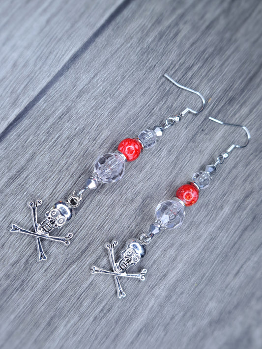 Clear and red beaded stainless steel skull cross bones dangle earrings