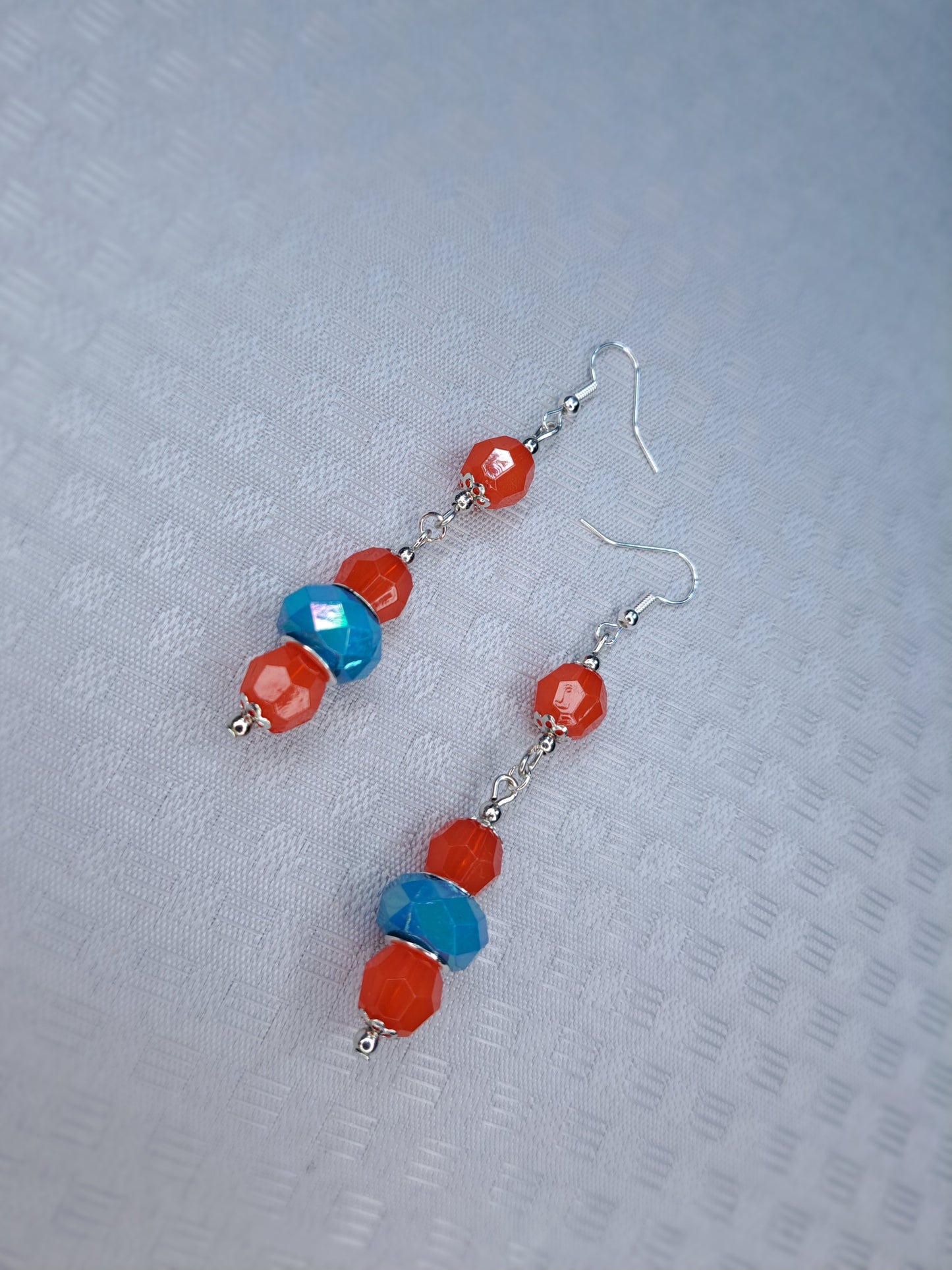 Orange and blue dangle earrings