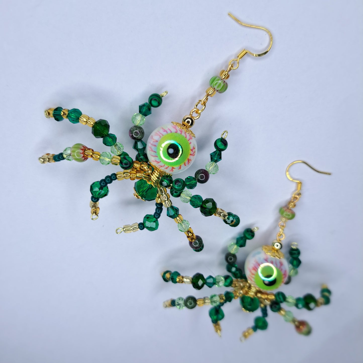 Green beaded eyeball spider gold tone s925 sterling silver earrings