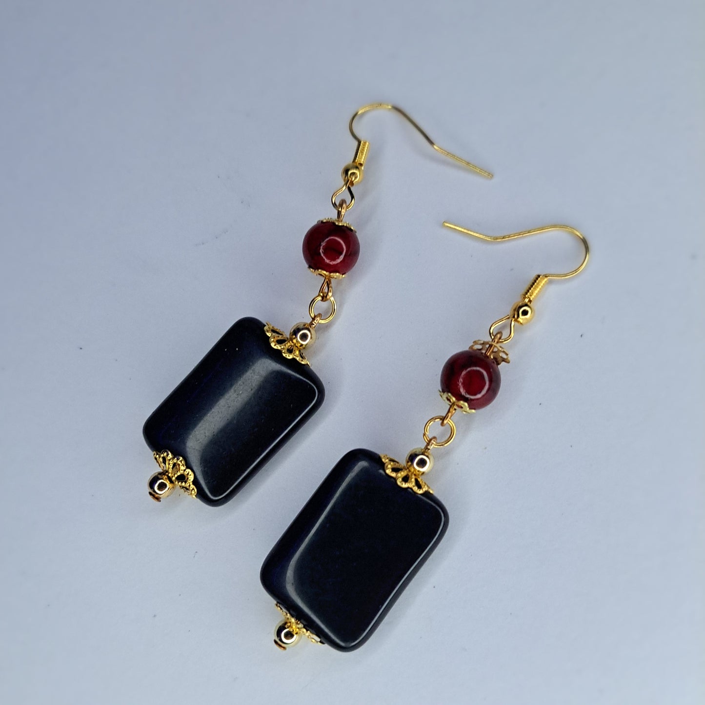 Stainless steel gold tone black charm earrings