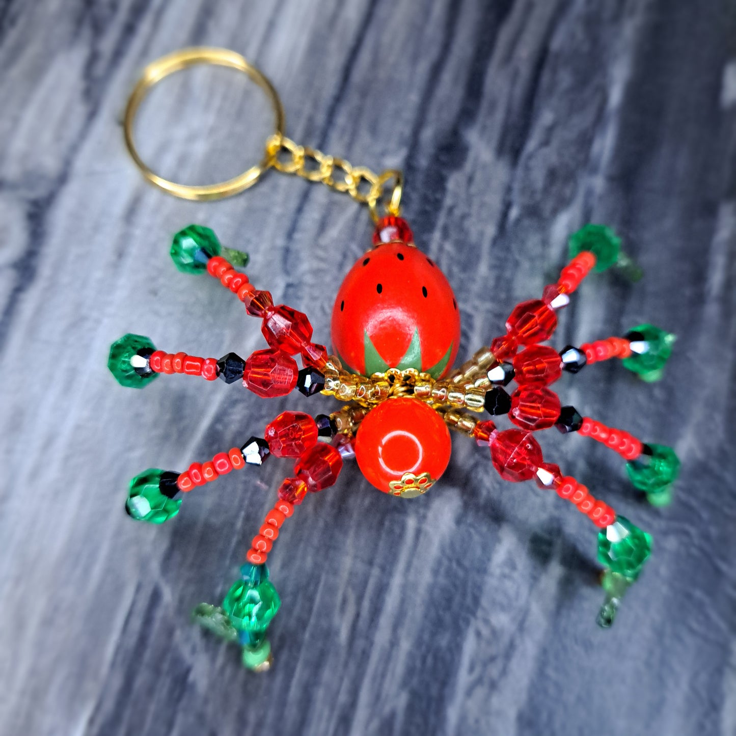 Strawberry Beaded spider gold tone keychain