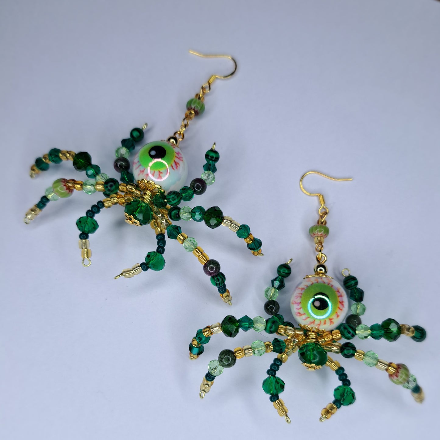 Green beaded eyeball spider gold tone s925 sterling silver earrings