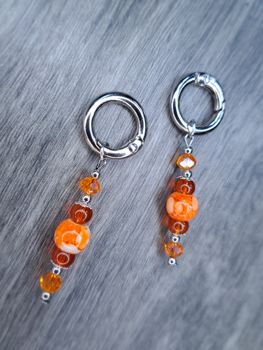 (Stretched ears) Orange beaded stainless steel earrings