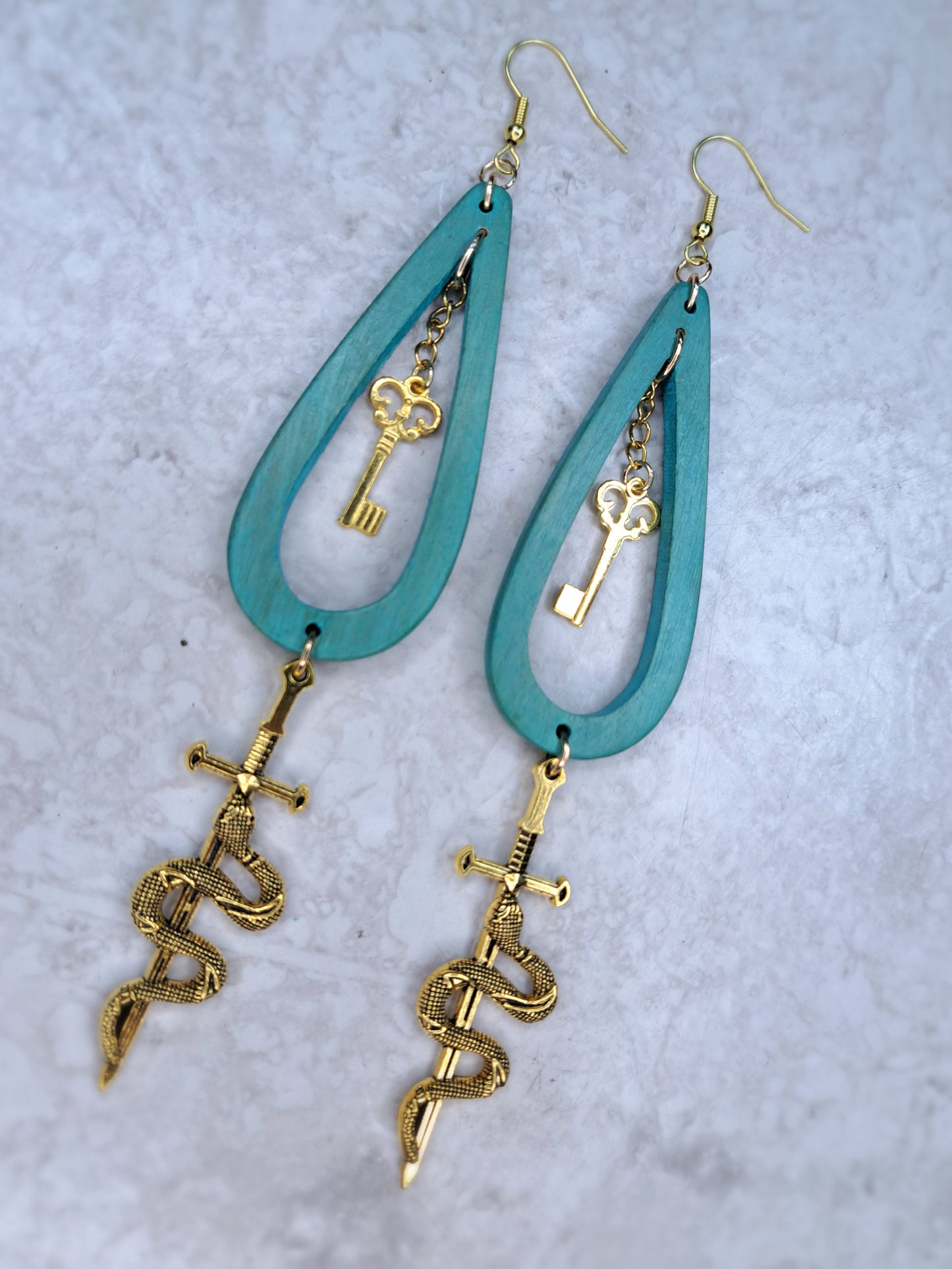 Greet wood beaded gold snake sword hoop earrings